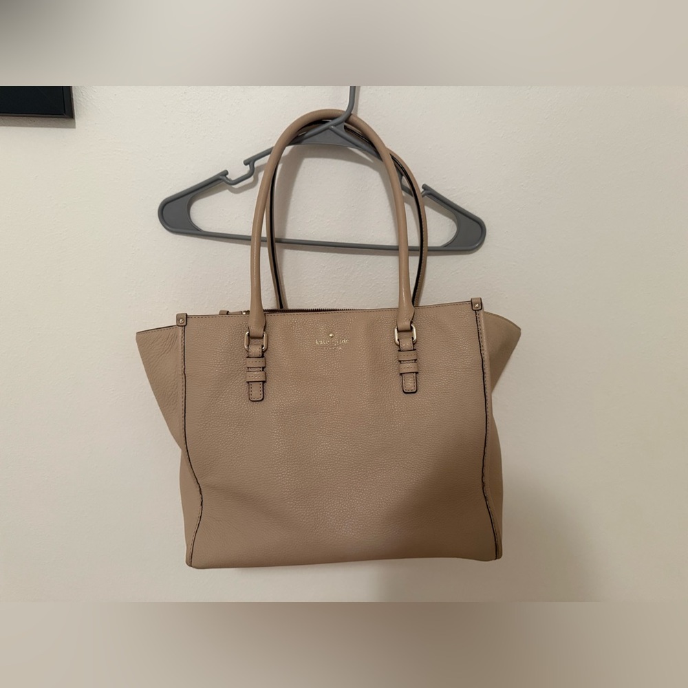 Kate spade shoulder purse. Used with a slight stain at bottom of bag.
